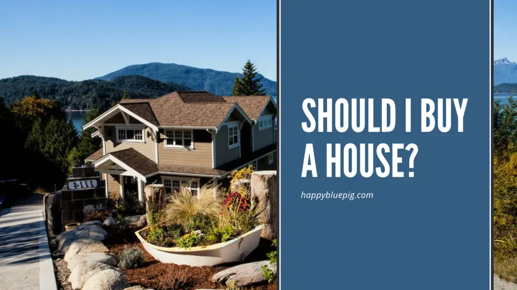 Image of a home on a hill overlooking water and mountains in the background, caption reads: Should I buy a house?
